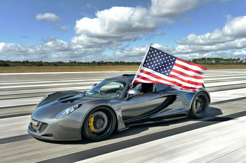 Venom GT running on road with US flag